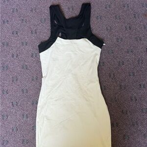 Bebe Elegant Black Dress with cutouts.